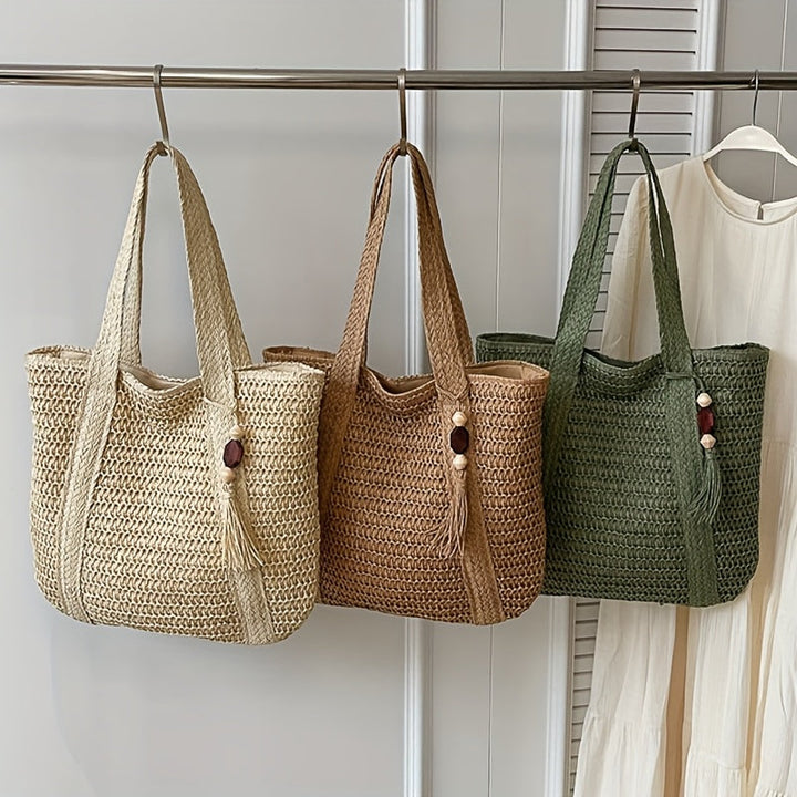 Natural fiber woven straw tote, ideal as a boho beach bag or everyday summer accessory for women.