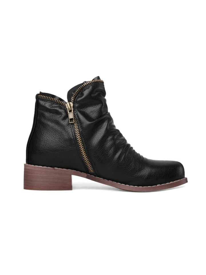 Chic women's western ankle boots with wrinkled detail, functional double zip, and low heel for versatile fall fashion.