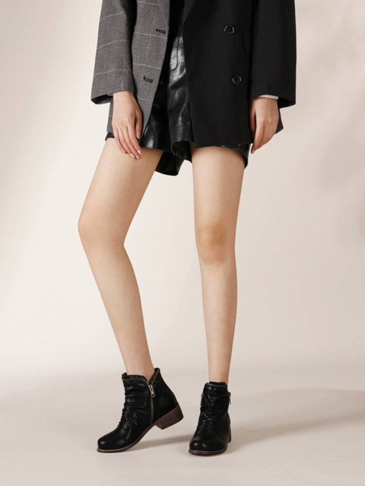 Women's comfortable western ankle boots with low heel, double zip, wrinkled texture, and classic round toe styling.