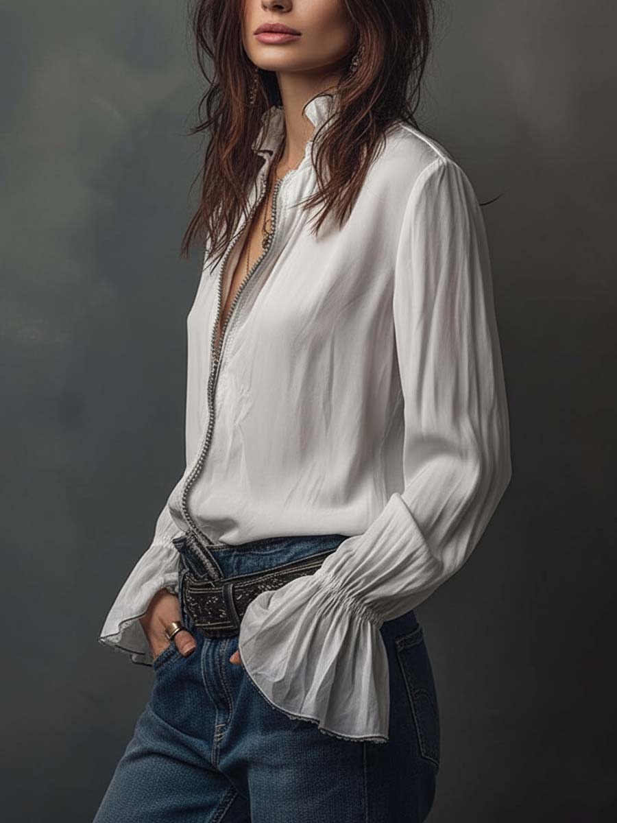 Tailored white women's blouse featuring a zip-front closure and stylish bell cuffs; modern office apparel.
