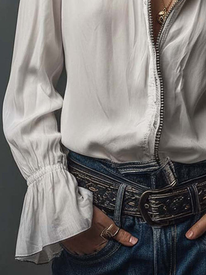 Elegant women's blouse: zip-front design, long sleeves, and sophisticated bell cuffs for a polished look.