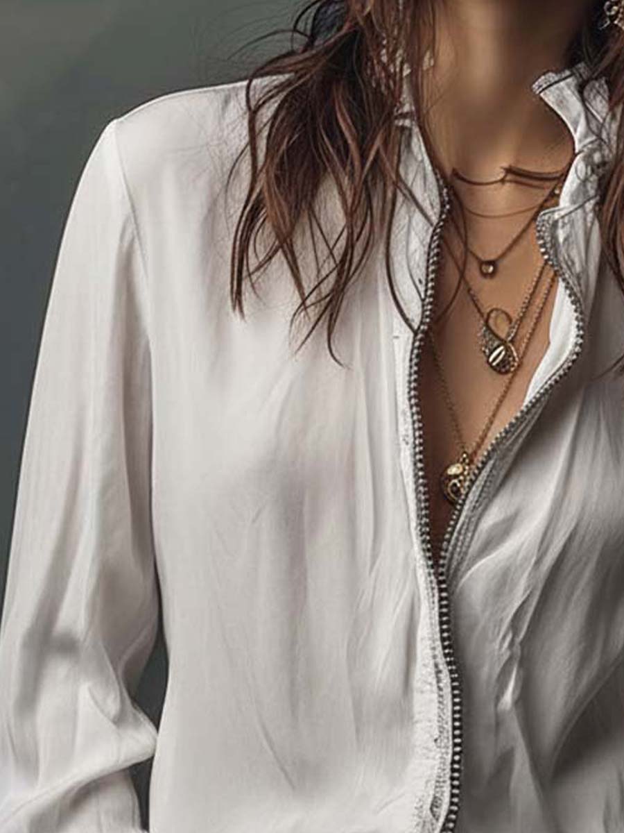 Versatile women's blouse with a practical zip-front and fashionable bell cuffs; ideal for work or casual.