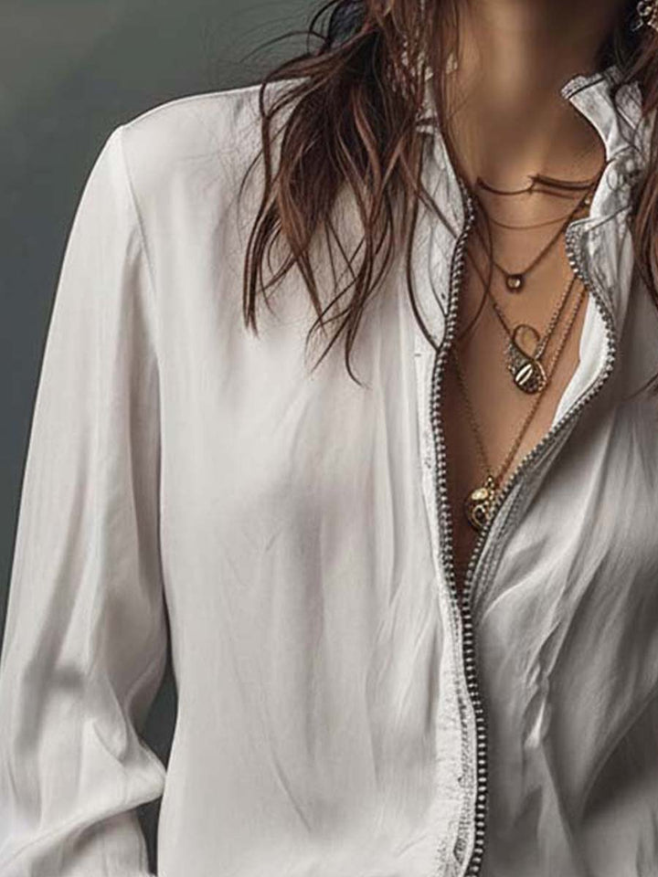 Versatile women's blouse with a practical zip-front and fashionable bell cuffs; ideal for work or casual.