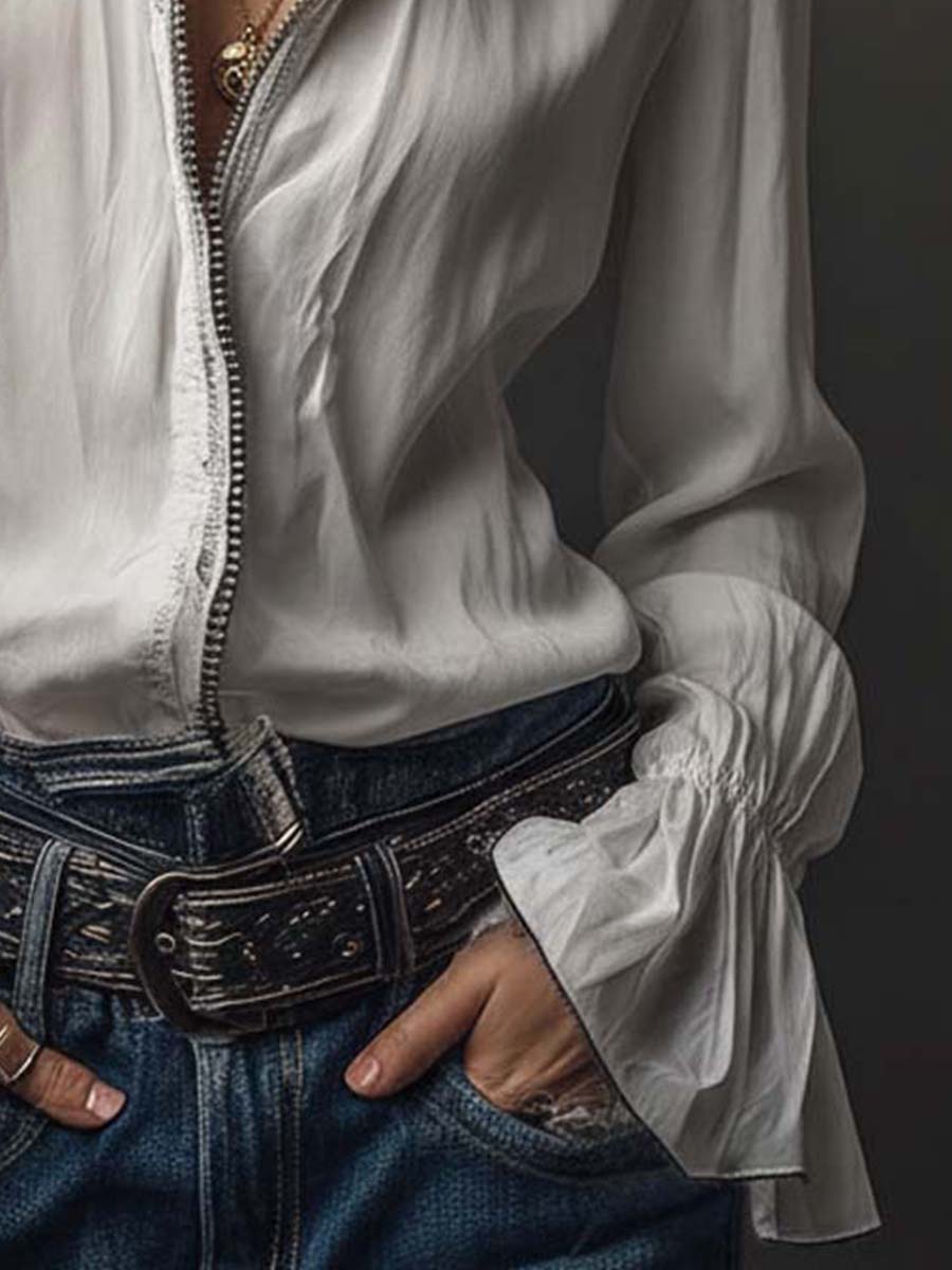 Stylish long-sleeve women's blouse, featuring a sleek zip-front and elegant bell cuffs; tailored modern fit.