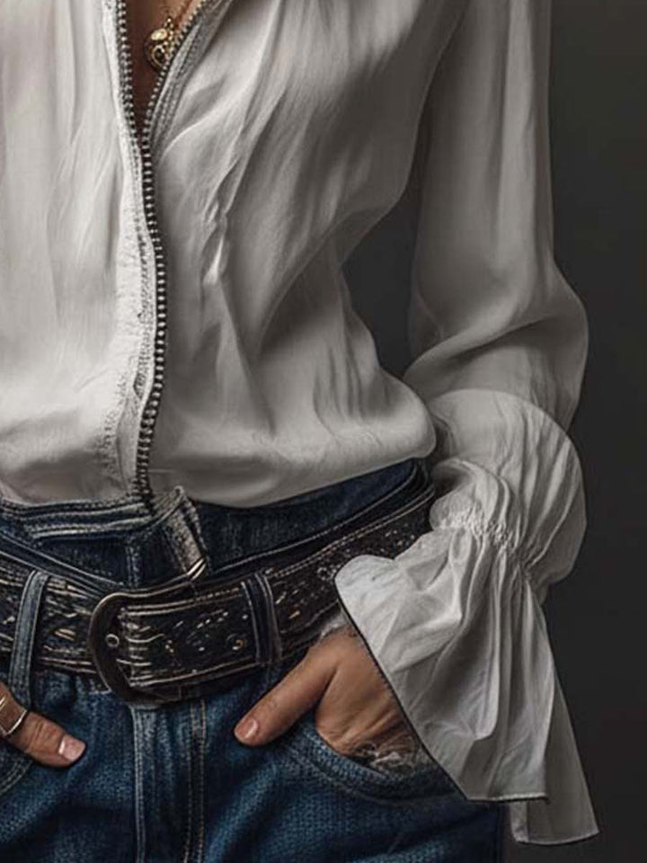 Stylish long-sleeve women's blouse, featuring a sleek zip-front and elegant bell cuffs; tailored modern fit.