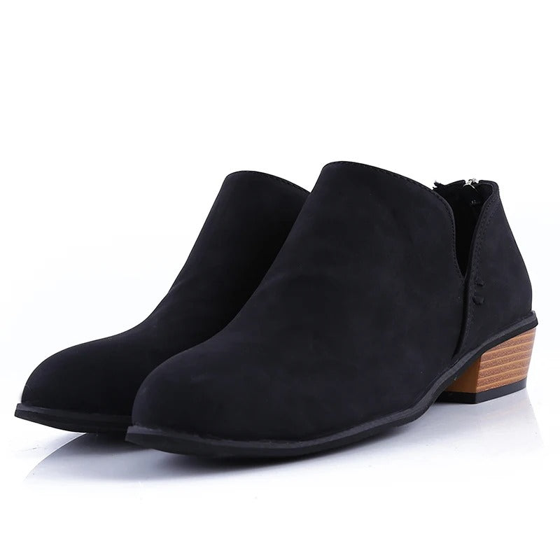 Fashionable women's ankle boots with a sturdy low block heel & easy back zip closure. Great for versatile style.