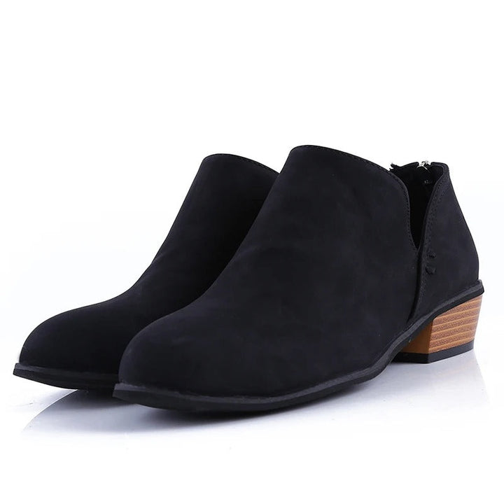 Fashionable women's ankle boots with a sturdy low block heel & easy back zip closure. Great for versatile style.