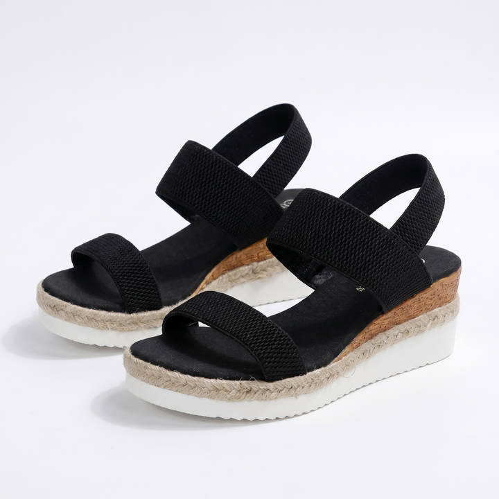 Fashionable women's wedge sandals, providing arch support & comfort for casual wear.