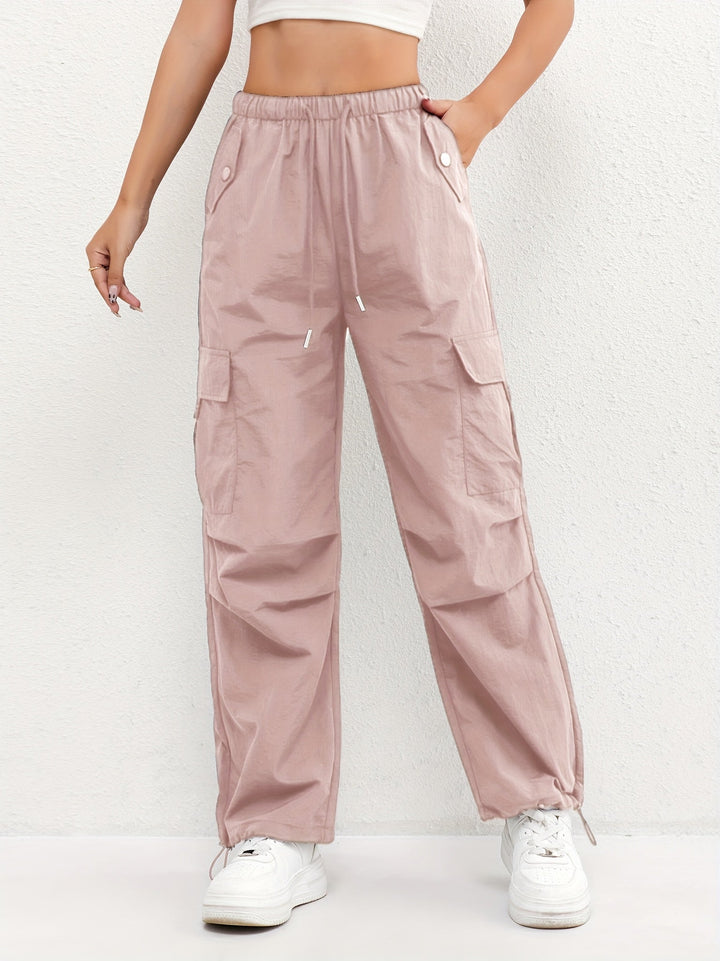 Trendy women's loose fit cargo parachute pants with drawstring waist & utility pockets, perfect for streetwear.
