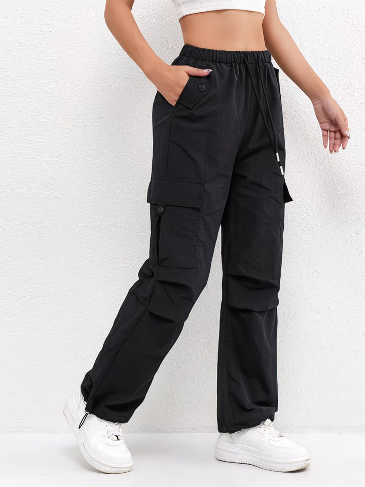 Casual women's drawstring parachute pants in a loose fit, ideal for everyday comfort & style.