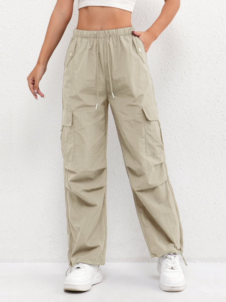 Women's trendy cargo parachute pants, showcasing a comfortable drawstring waist and stylish loose fit.