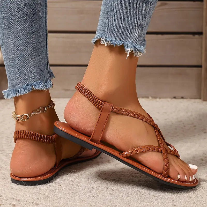 White slip-on flat sandals for women, open toe with comfy elastic crisscross straps.