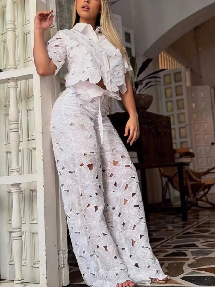 Women's floral lace two-piece set with a cropped top & wide leg pants. Perfect for summer & vacation fashion.