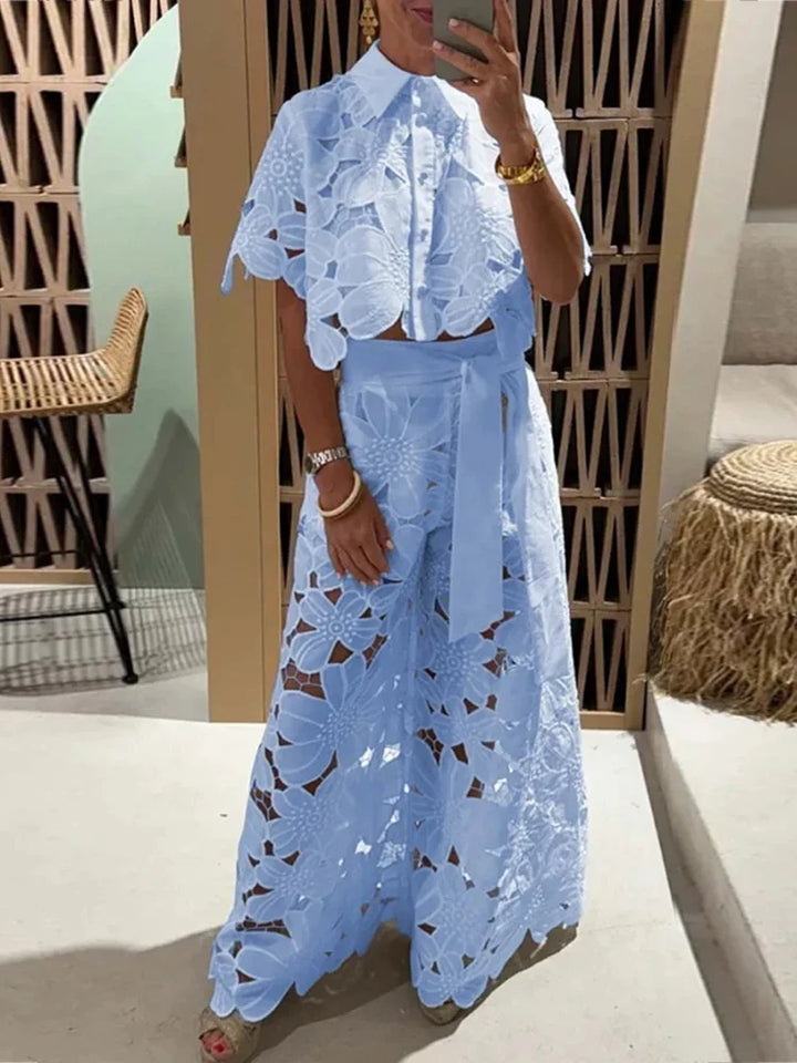 Stylish women's floral lace matching set with a cropped top & wide leg pants. Chic spring & summer outfit.