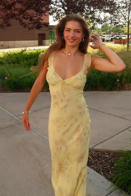 Flowy scoop neck women's summer maxi dress with vibrant floral print and thin spaghetti straps.