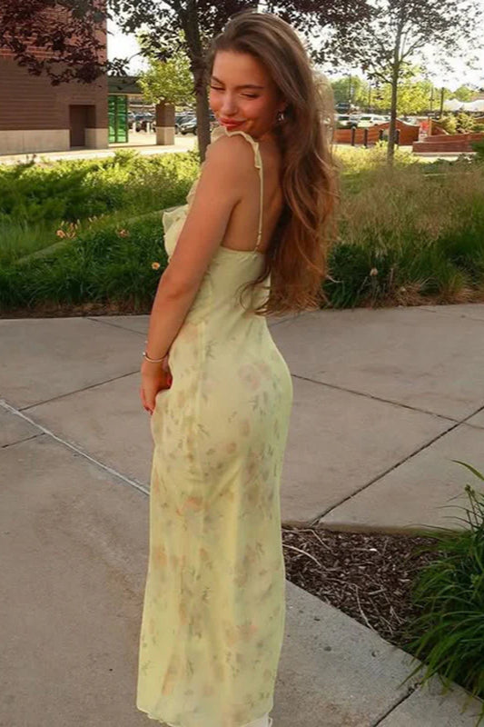 Elegant yellow floral slip dress for women, featuring a flattering scoop neck and spaghetti straps.
