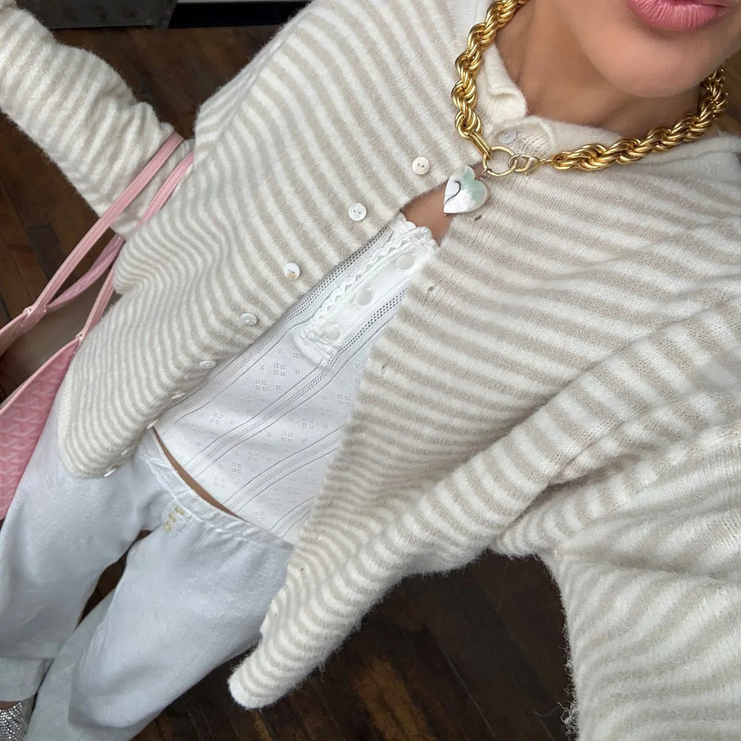 Versatile long-sleeve women's knit cardigan with classic stripes and functional front buttons.