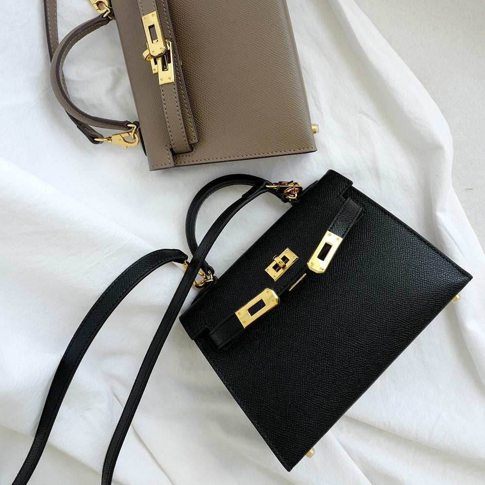 Fashionable brown structured crossbody bag for women, perfect for daily use, with a secure top handle & turn lock.