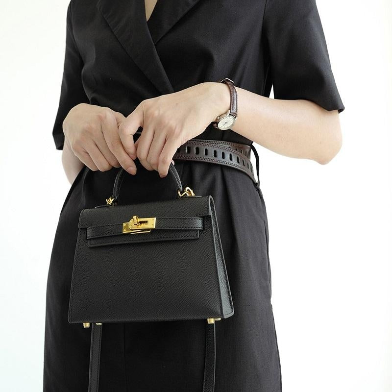 Versatile women's structured handbag: wear as a top handle, shoulder, or crossbody bag with a chic turn lock.