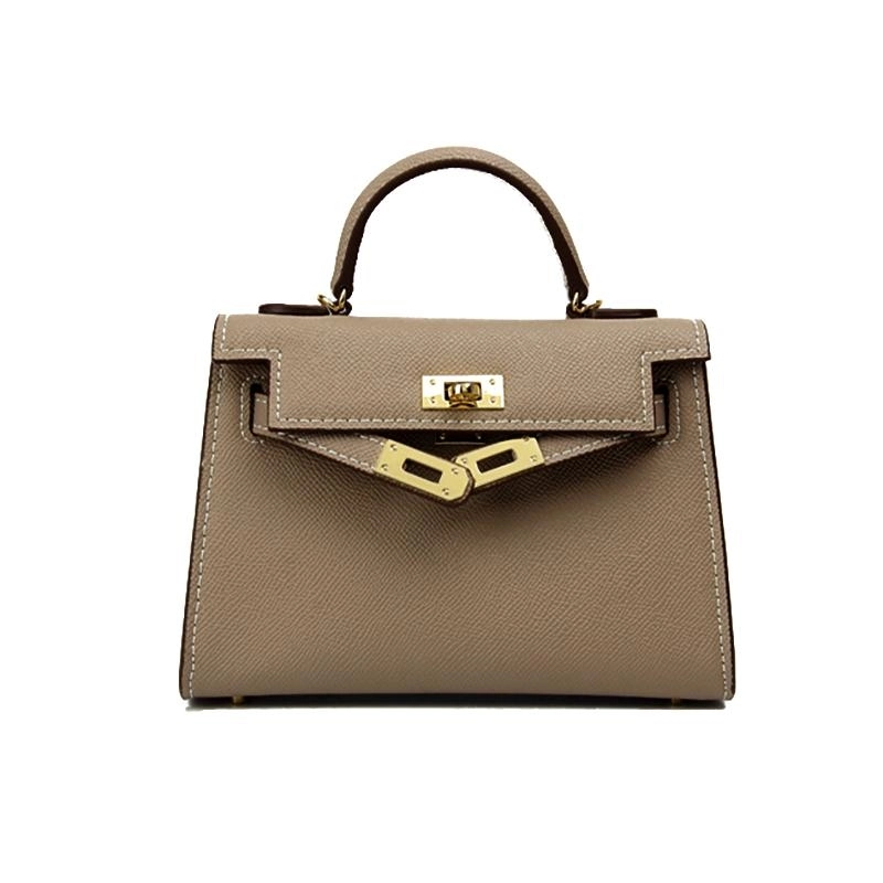 Modern beige structured crossbody bag with a sleek turn lock and elegant top handle, perfect for any outfit.