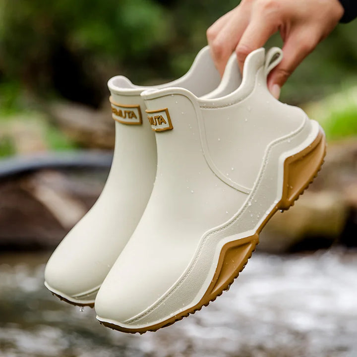 Fashionable women's slip-on ankle rain boots, weatherproof comfort for outdoor adventures.