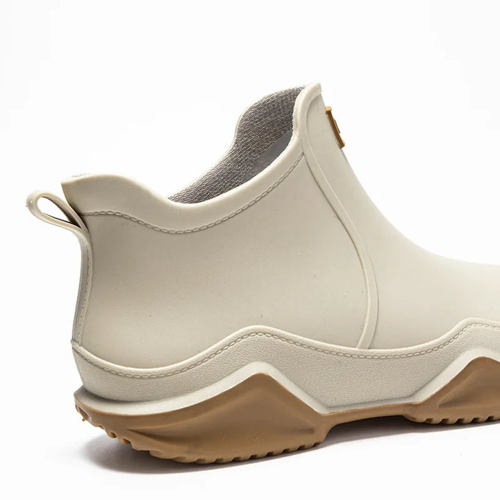 Women's waterproof ankle boots in khaki, slip-on design for effortless wet weather style.