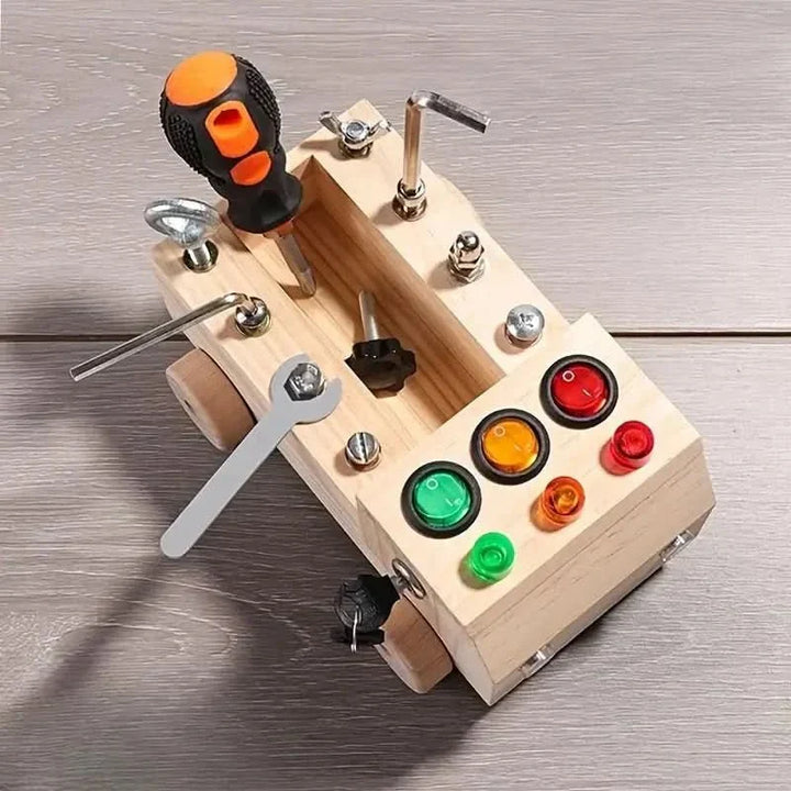 Interactive wooden activity board for children. Busy board features latches, gears, & buttons for skill development.