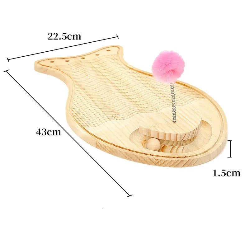 Jumping cat playing with the feather ball on a wooden interactive scratching board