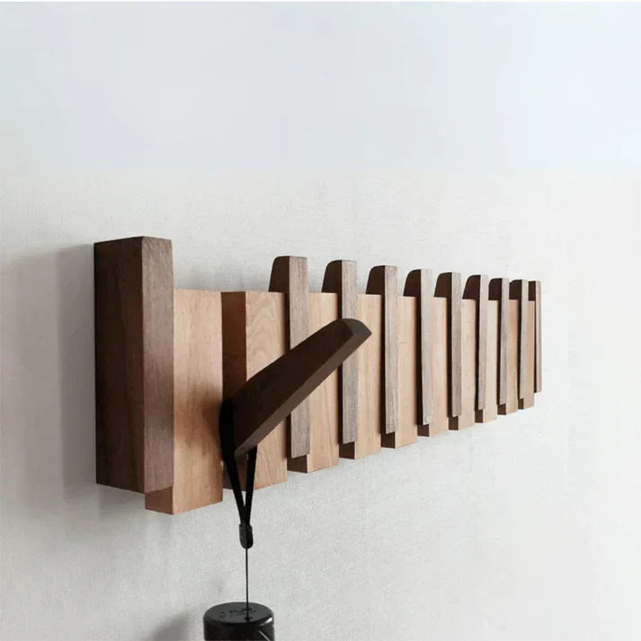 Elegant piano style wall mount coat rack in wood finish. Perfect for entryway storage & home decor.