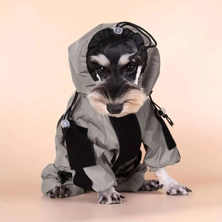 Close-up of dog raincoat fabric showing waterproof material and reflective strip detailing.