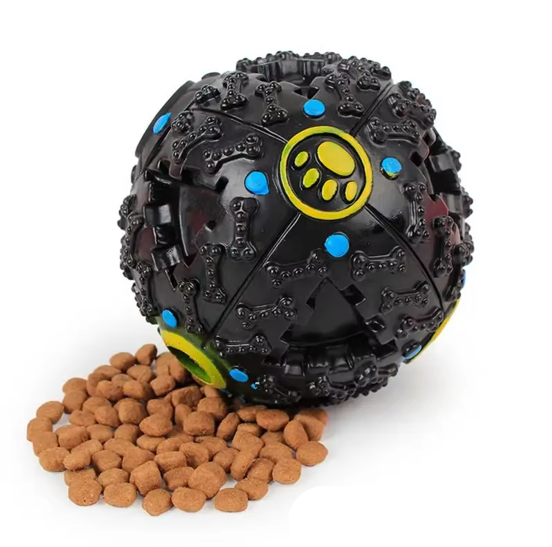 Yellow interactive dog squeaky treat ball with bone-shaped openings for mental stimulation.