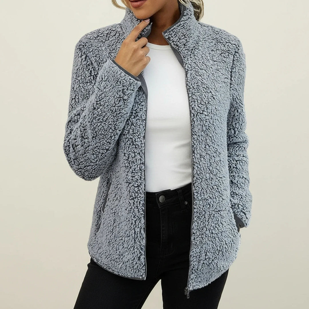 Chic women's warm winter jacket with stand collar, offering cozy comfort and casual style.