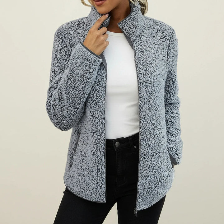 Chic women's warm winter jacket with stand collar, offering cozy comfort and casual style.